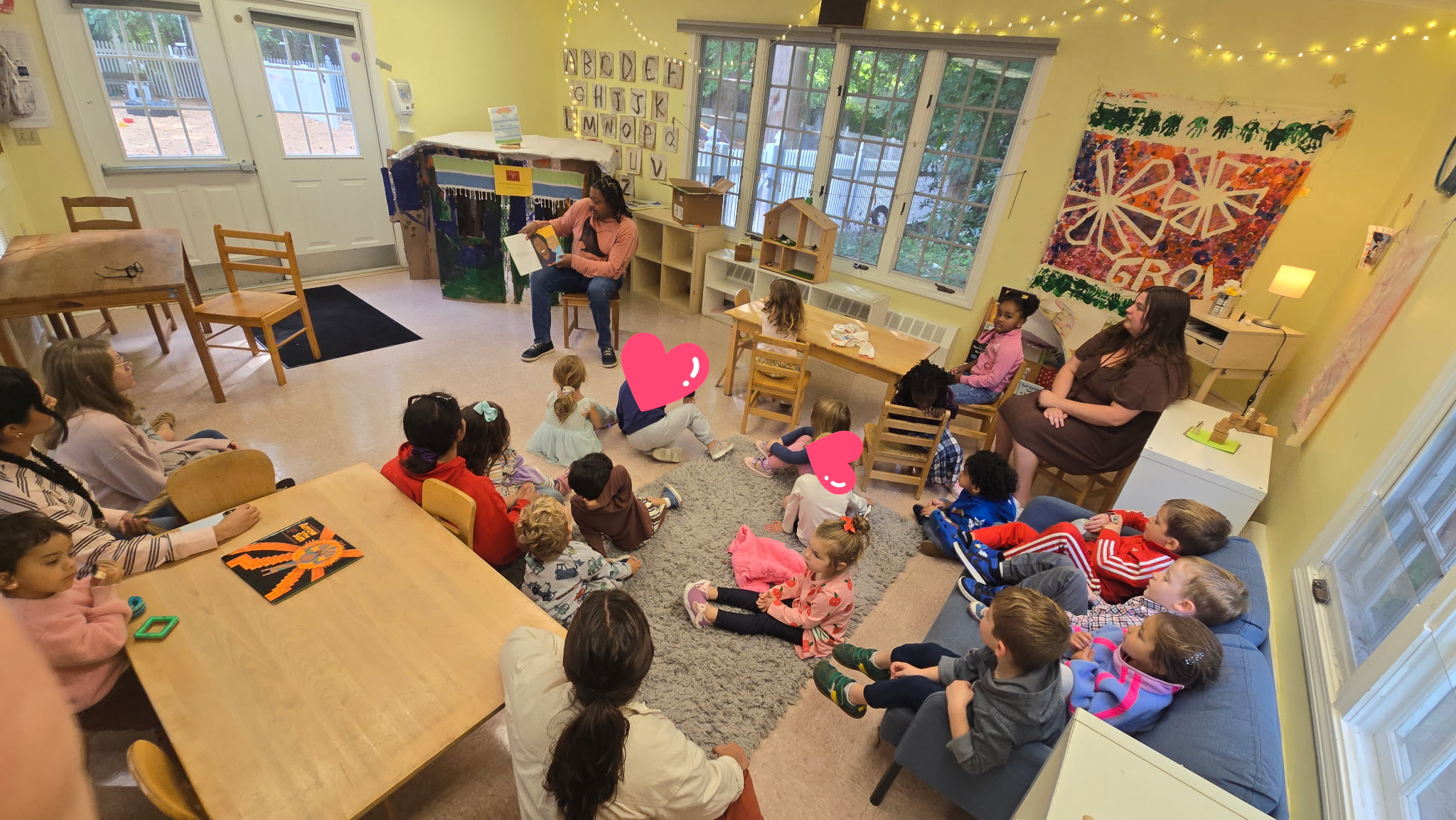 Rod Cornish reading to preschoolers at the Children's Learning Center at Mitchell College